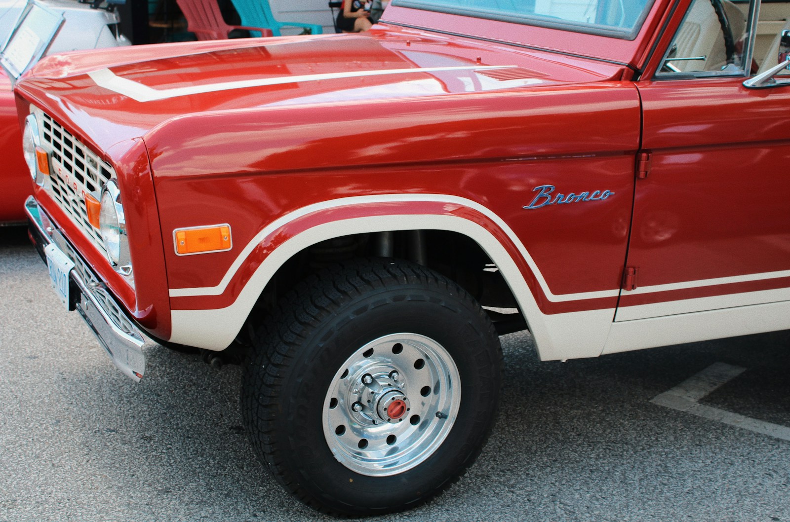 a red truck parked in a parking lot